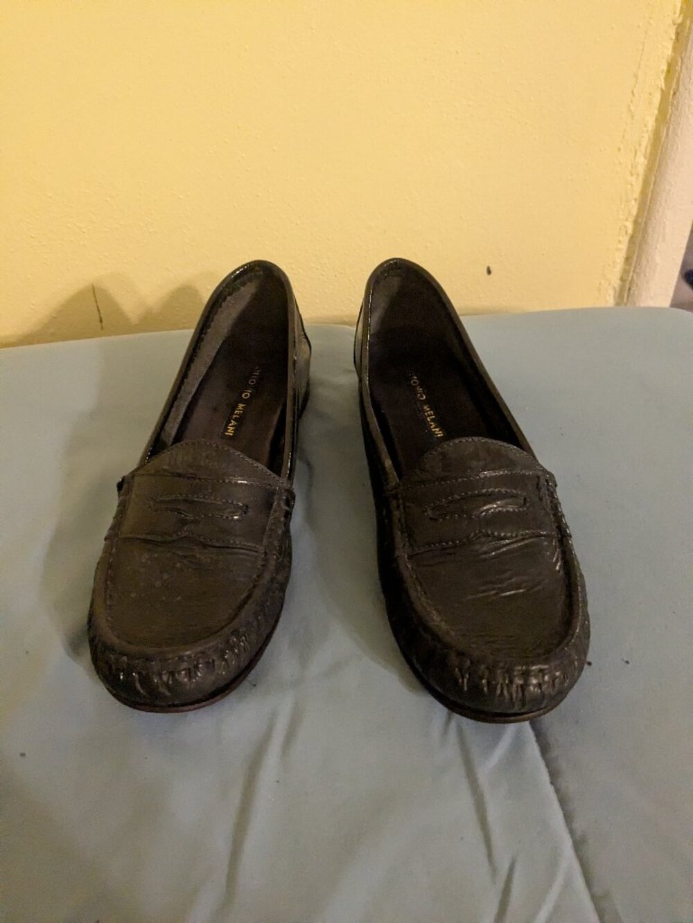 Dark blue patten leather loafers.
